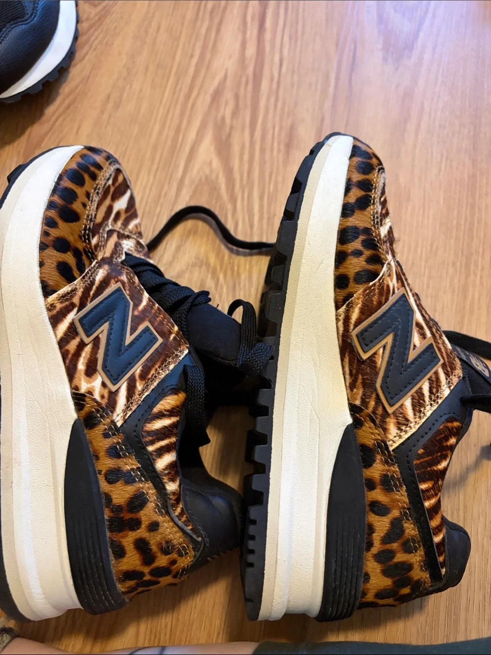 New Balance women’s Leopard-Print Sneakers in Brown and Black
